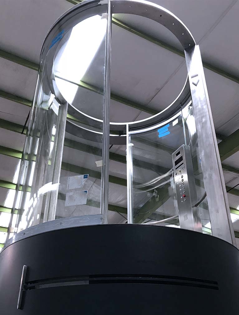 Museum of Art custom glass tubular elevator