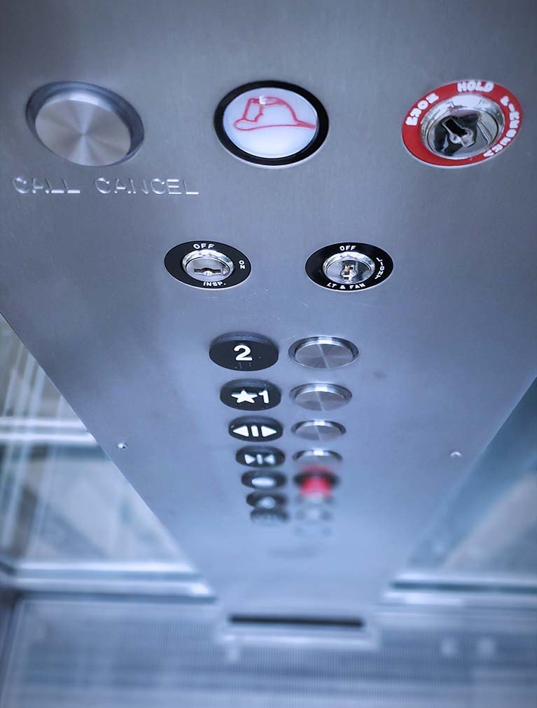 Richard Mille NYC Flagship elevator call buttons on brushed steel